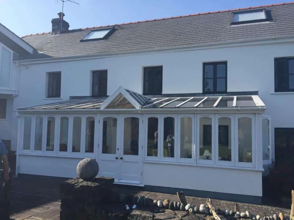 Lean-to conservatory with old roof before solid roof replacement